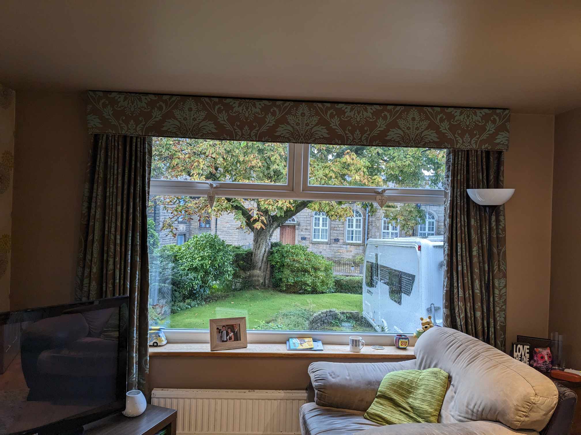 A bright living room with a view through white windows